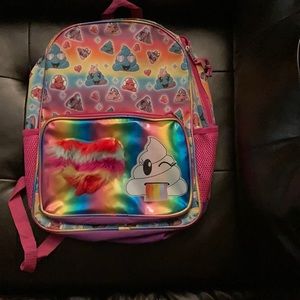 A rainbow poop emoji backpack